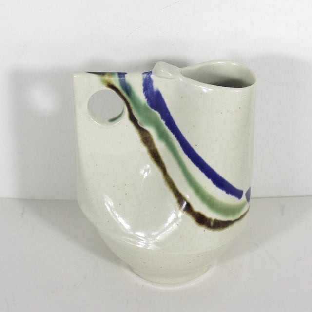 Eighties vintage studio pottery jug or pitcher or vase. No damage. 7.5” tall 5.5” wide at handle 4.5” deep Find a matching...