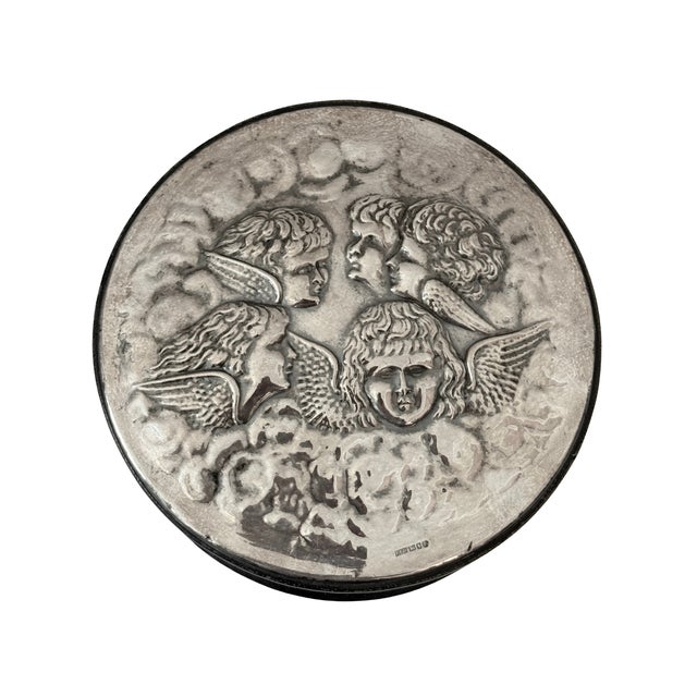 A beautifully crafted Art Nouveau‑style sterling silver and leather box, hallmarked London 1993. The round silver lid...