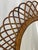 Italian Riviera original hand woven oval rattan mirror with burgundy velvet backing. Designed by Franco Albini, c. 1960's....