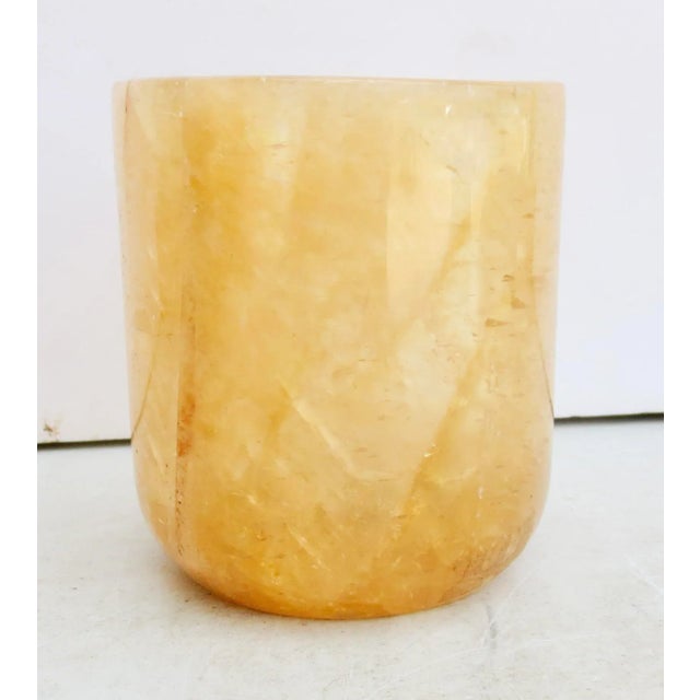 Rock Crystal calcite cup. Amber-colored bowl with thick walls, and faceted crystals that move in diagonals and horizontal...