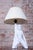 This interesting table lamp originates from the 1970s and stylistically follows the rich tradition of figural lamps that...