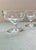 These charming early 20th century champagne glasses feature a cross pattern between a pair of three-ring borders. Their...