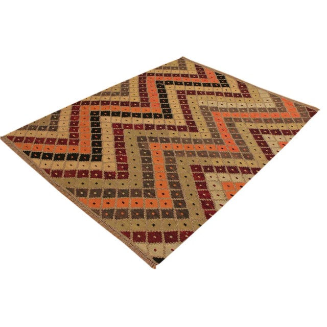 Add a touch of elegance to your home with this casual chic hand woven Tribal Kilim wool rug. Constructed on a loom by...