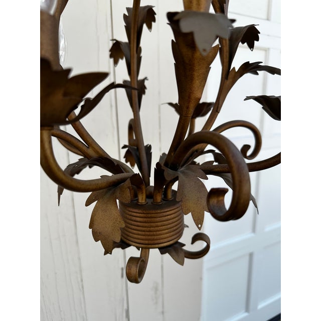 Old Lights On is pleased to offer this petite vintage four arm Hollywood Regency chandelier. It is wired and ready to...