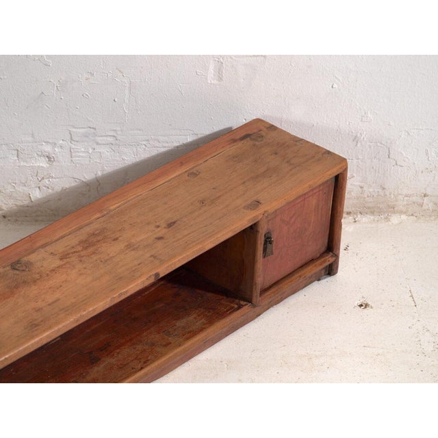 Antique low sideboard in pine wood, traditional chinese furniture originating from gansu and dated circa 1930. Originates...