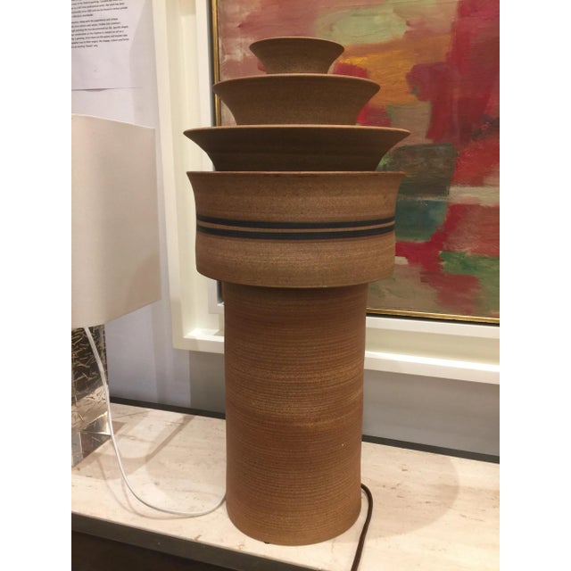 Lamp by Arne Bang, Danish 20th century Studio Potter. Built in two sections, the crown is removable to allow access to the...