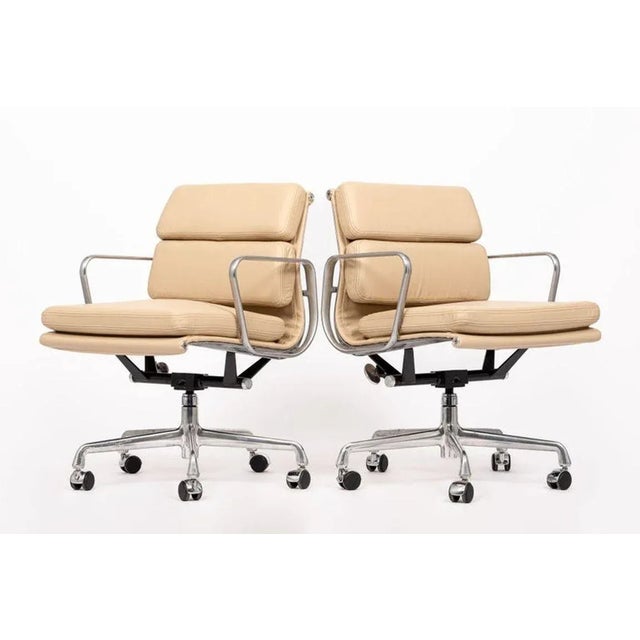 These authentic Eames for Herman Miller Soft Pad Management Height cream leather office chairs from the Aluminum Group...