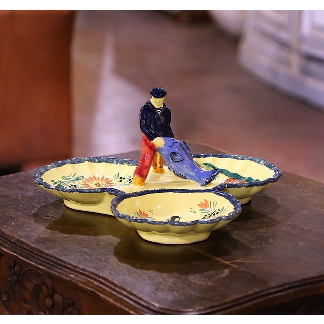 Serve peanuts or chips in style with this colorful, antique Quimper dish. Sculpted in Brittany, France, circa 1950, the...