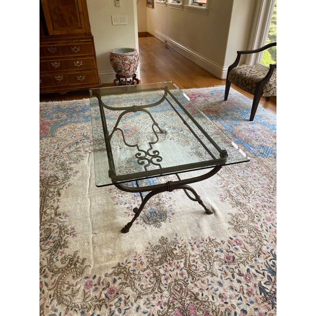 Elegant glass table with beveled glass. It would look beautiful in a living room or study. The date this was made is...