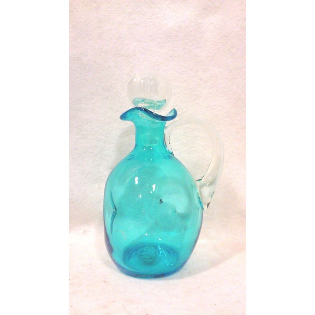 Turquoise hand crafted decanter from the Mid-Century era made by American glass company Bischoff. This vintage decanter...