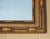 A charming vintage rectangular wall hanging mirror, featuring a decorative faux bamboo frame with a warm golden-brown...