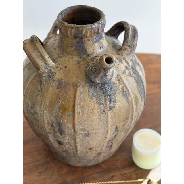 This rare 18th century French oil jug is a beautifully timeworn example of everyday utilitarian pottery elevated by...