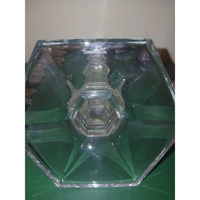 Tiffany & Co. Windham candle holder set, crafted from clear cut crystal. It features a distinctive faceted, stacked pillar...