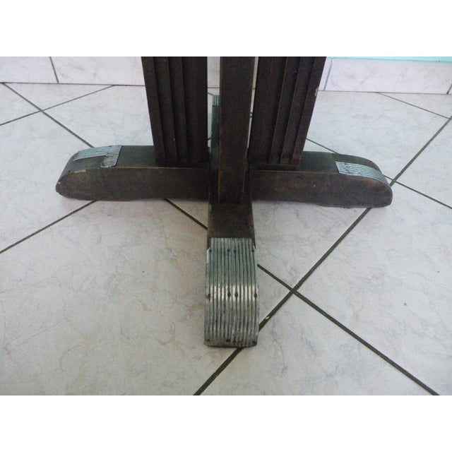 A 1950s bistro table made entirely of wood, unrestored; note the craftsmanship of the four legs enhanced with zinc.