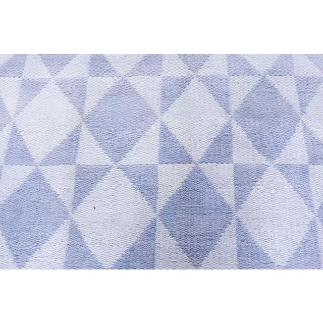 ?This vintage Indian cotton rug, dating back to circa 1950, is a distinguished offering from Doris Leslie Blau, renowned...