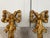 A striking pair of vintage giltwood wall sconces by Decorative Crafts Inc., Hand Crafted Imports. Beautifully carved with...