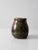 A vintage studio pottery vase with a substantial, hand-crafted form and expressive green and brown glaze. Signed by the...