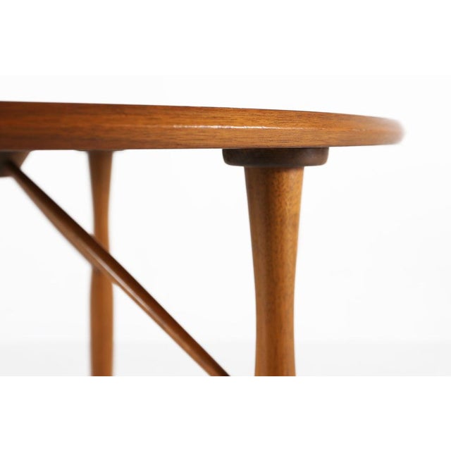 A beautifully crafted Belgian mid‑century coffee table from the 1950s, showcasing the clean lines, warm materials, and...