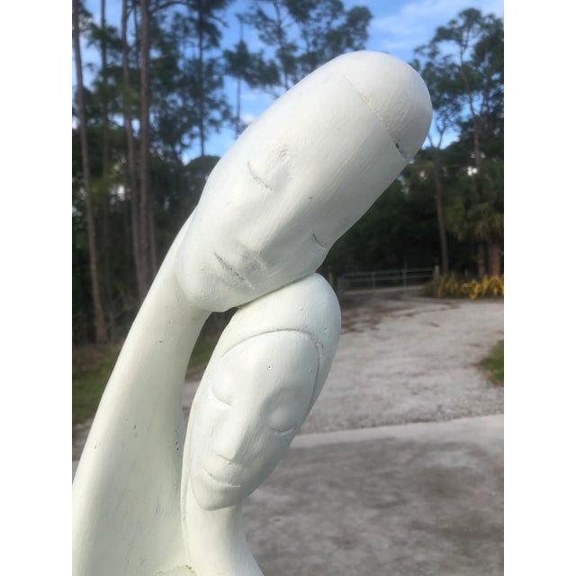 Fabulous white sculpture made of plaster depicting a new family consisting of dad, mom, and new baby. The sculpture is...