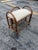 A charming vintage mid-century Italian vanity stool crafted in rattan with a light, airy silhouette and sculptural arched...