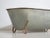 Antique galvanized zinc bathtub with iron structure, originating from Central Europe, circa 1900. This type of metal tub...