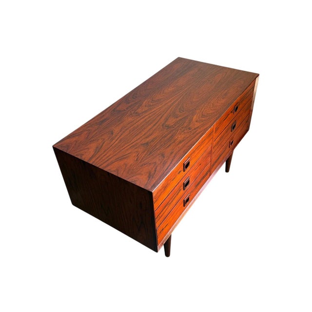 Beautiful mid-century modern Danish rosewood console cabinet by Brouer, featuring stunning bookmatched rosewood grain and...