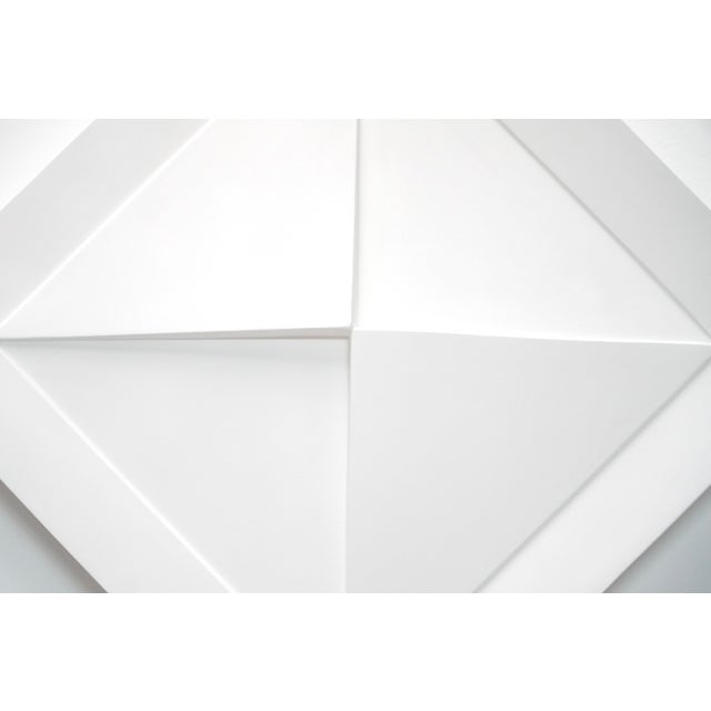 Created by Belgian abstract artist Gilbert Swimberghe in 1977, this white lacquered wood relief catches the eye with its...