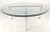 This vintage modern circular coffee table features a heavy "X" shaped base with 1" thick green glass. The unique design...