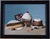 This oil on panel artwork presents a delightful still life of various confections, including a decadent cupcake topped...