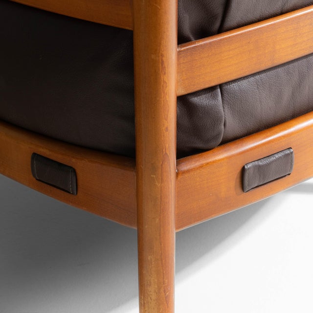 This 1960s Danish mid-century modern armchair by Ellekær & Norell for Coja exemplifies the era's focus on comfort-driven...
