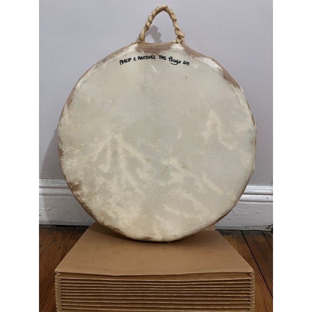 Painted drum, wood with animal hide, by Taos Pueblo, New Mexico artist Phillip C. Martinez. Signed. Features three horses...