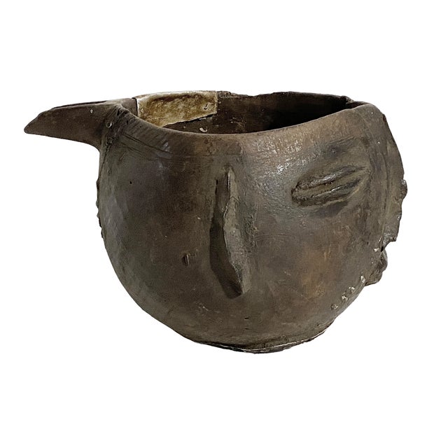 A well carved Kuba wooden cup in the form of a human head. Figural cups such as this cups are among the most popular...