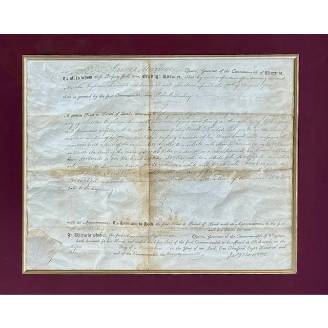 A remarkable and museum-worthy piece of early American history, this framed display presents an original Virginia land...