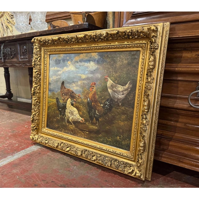 A charming example of 19th-century Belgian animal painting, this antique oil on canvas depicts a colorful barnyard scene...