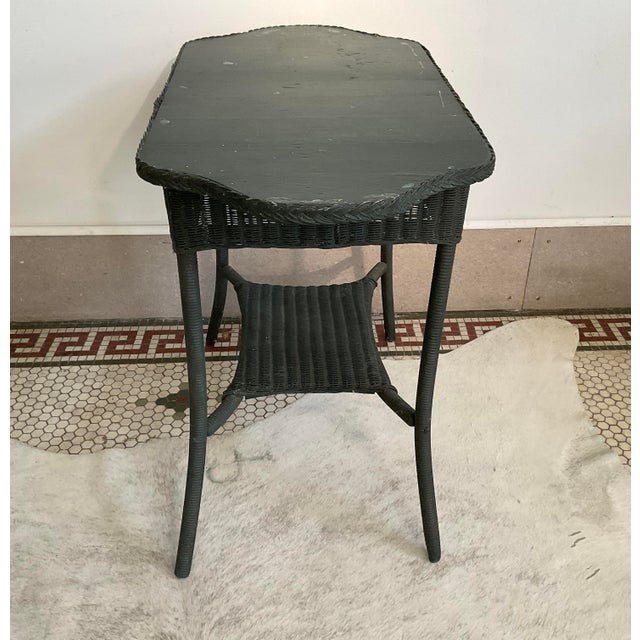 Add a touch of historic charm and artisanal craftsmanship to your space with this vintage 1930s woven paper accent table...