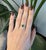 A 1.21ct zambian emerald emerald cut ring set in solid 14K yellow gold, set with six earth mined diamonds. Emerald, the...