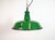 Industrial green enamel pendant light made by revo in united kingdom during the 1950s. White enamel inside the shade. Iron...