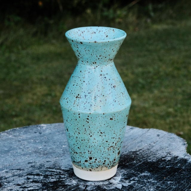 "Angular stoneware vase, wheel-thrown from white stoneware and hand-painted with "Cenote" - (bluish) glaze. Brand: Hiraeth...
