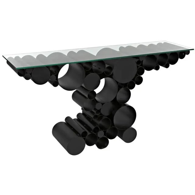 Recreating the lightness and fragility of bubbles from the rigidity of industrial steel, the Paradox console is built from...