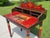 A charming and character-filled hand-painted secretary desk by Three Hands Corp., featuring a whimsical equestrian motif...