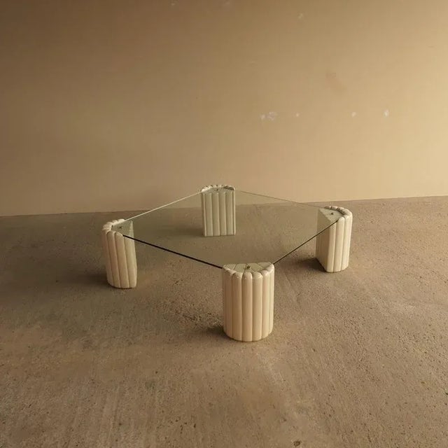 Tommaso Barbi Coffee Table Coffee table designed by Tommaso Barbi, Italy 1970. Ceramic legs with thick glass top and brass...