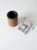 A vintage leather dice cup set featuring a classic leather cup and two dice. Its traditional design and timeworn character...