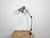 Large industrial table lamp with three adjustable joints made in former Czechoslovalia during the 1960s.It features a grey...