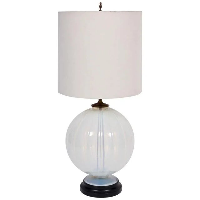 Elegant early 20th century Marius-Ernest Sabino attributed opaline art glass table lamp. Featuring a translucent and warm...