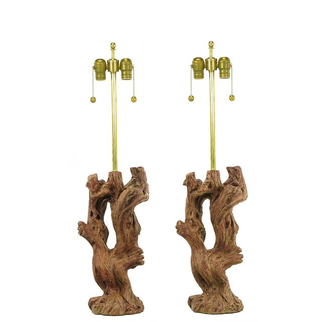 Pair of ceramic faux bois driftwood bodied table lamps with beautifully authentic glazing. Brass stem and double socket...
