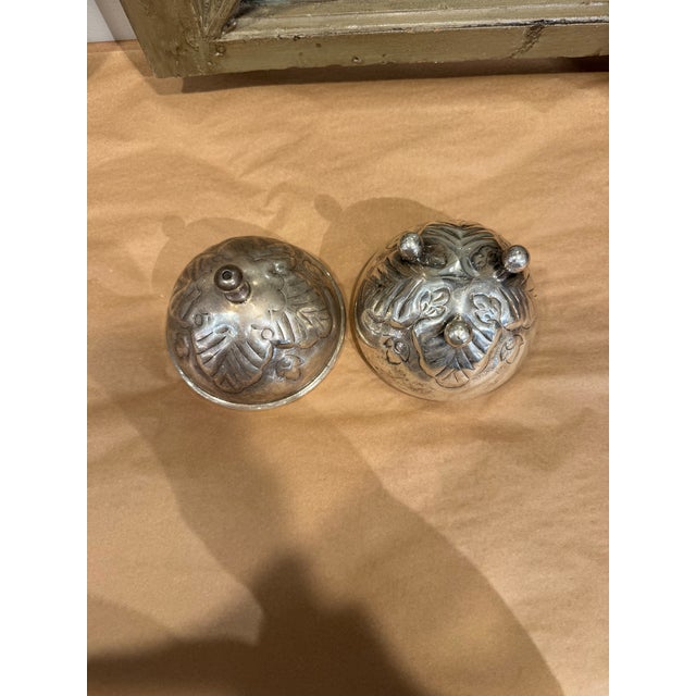 This is a vintage silverplate wool holder. It was used to hold round wool balls for knitting. It is adorable.