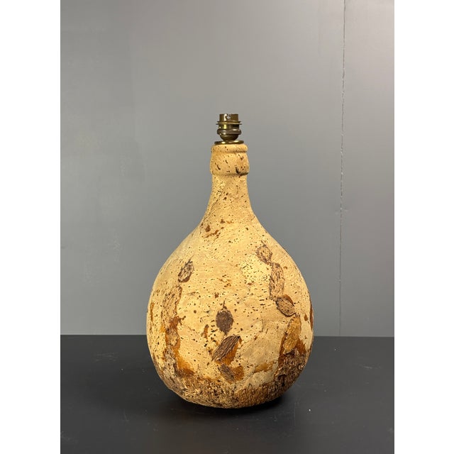 Lovely mid-century table lamp in cork with original cork shade. This lamp is equipped for a bajonet lightbulb and is in...