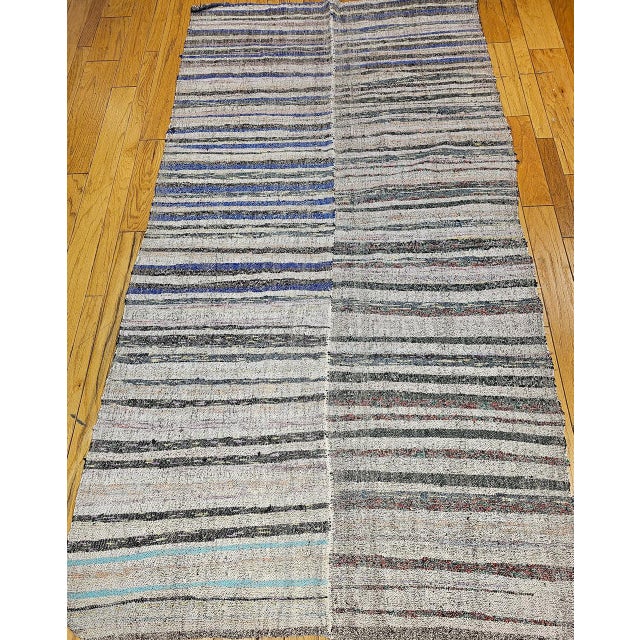 Handwoven in Turkey during the third quarter of the 20th century, this vintage Turkish kilim is a quietly confident piece...
