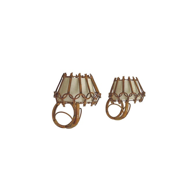Elegant bent organic Bamboo/Rattan Wall Sconces in the style of Louis Sognot, 1960s. Very nice designed, handcrafted from...