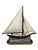 A vintage cast iron sailboat doorstop — a wonderfully heavy, hand-painted piece of American nautical folk art. Full pale...